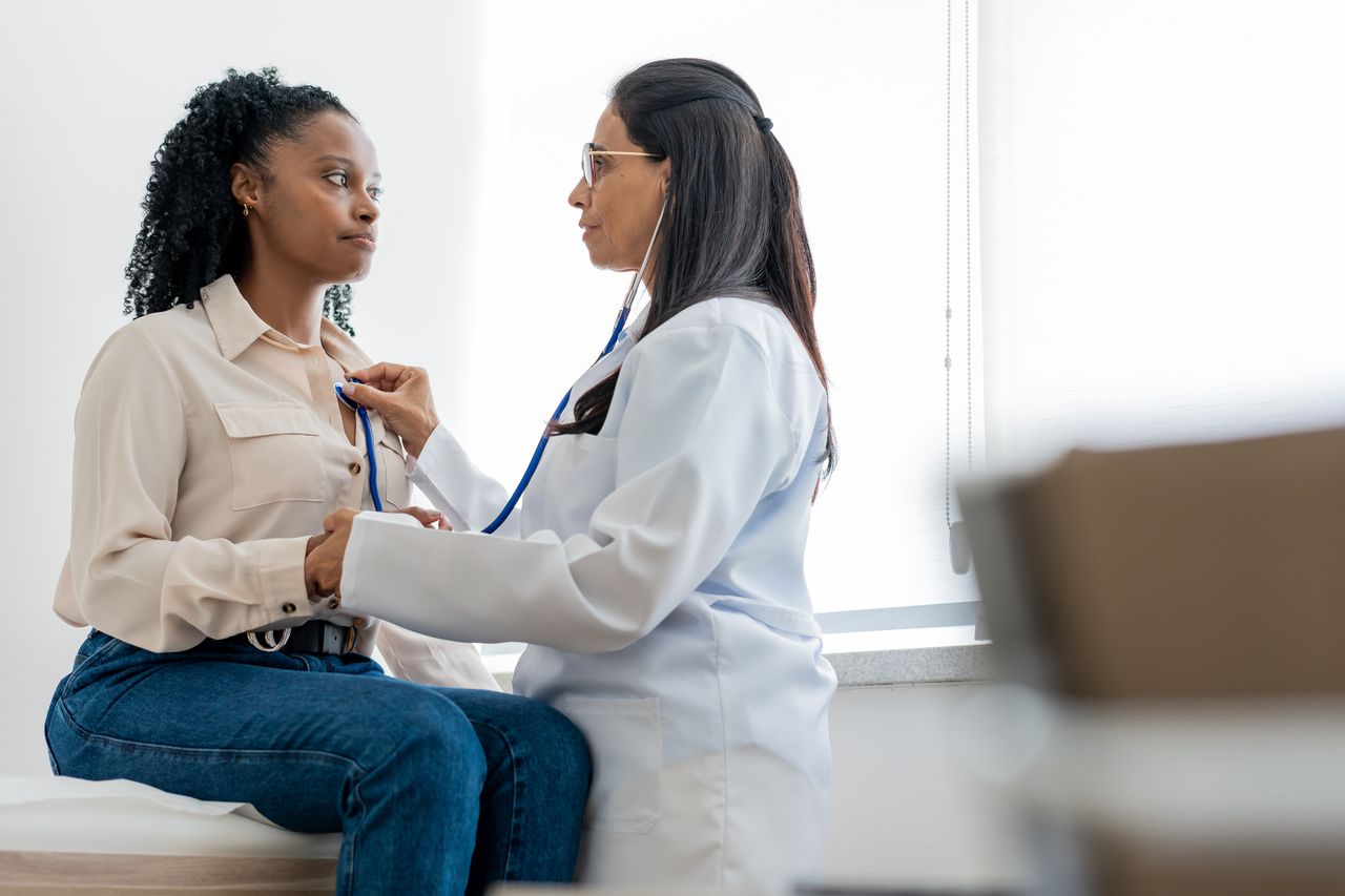 Woman checking heartbeat