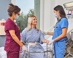 Two doctors meet with a patient at Hoag Orthopedic Institute