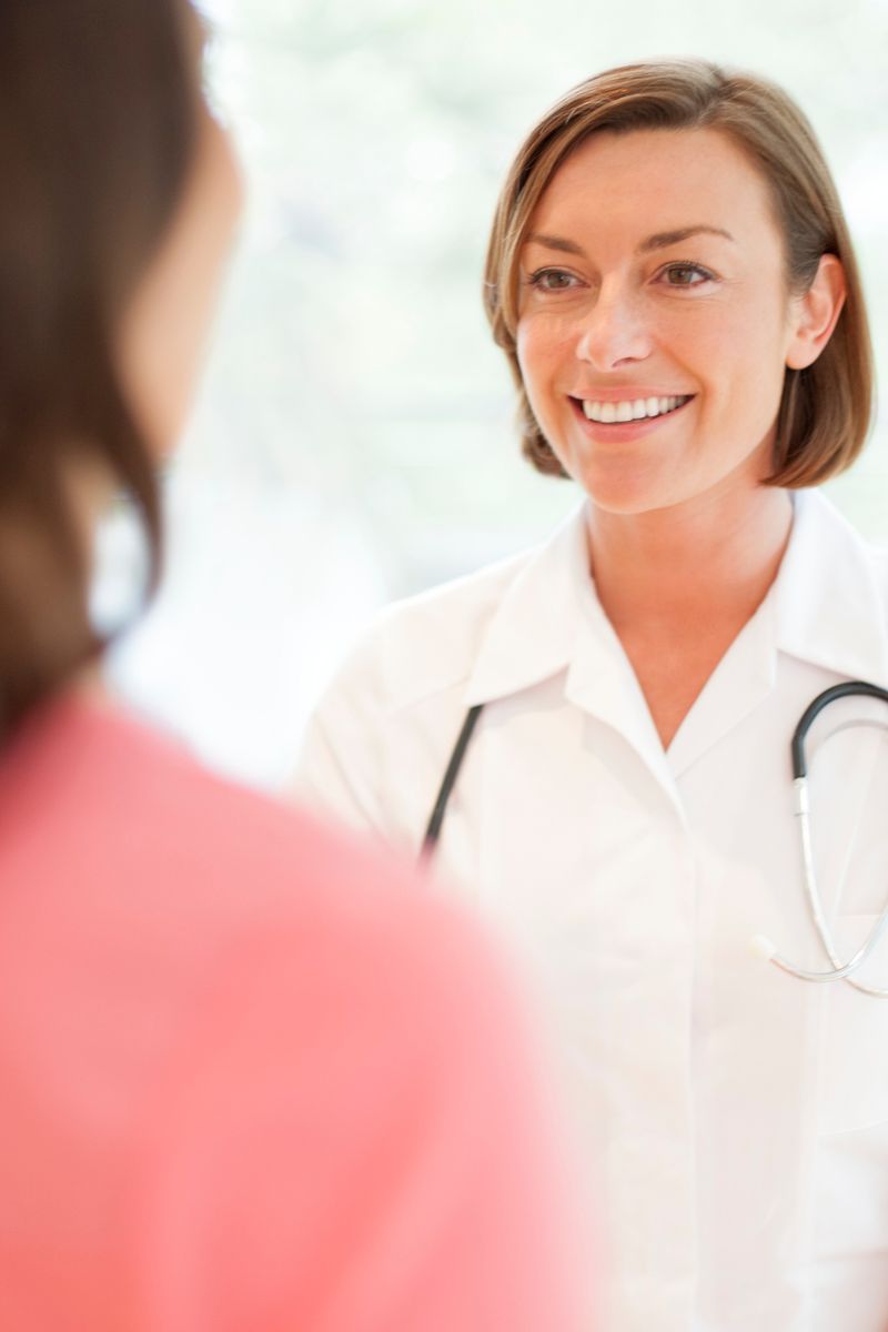 A woman talks to her gynecologic pelvic health doctor.