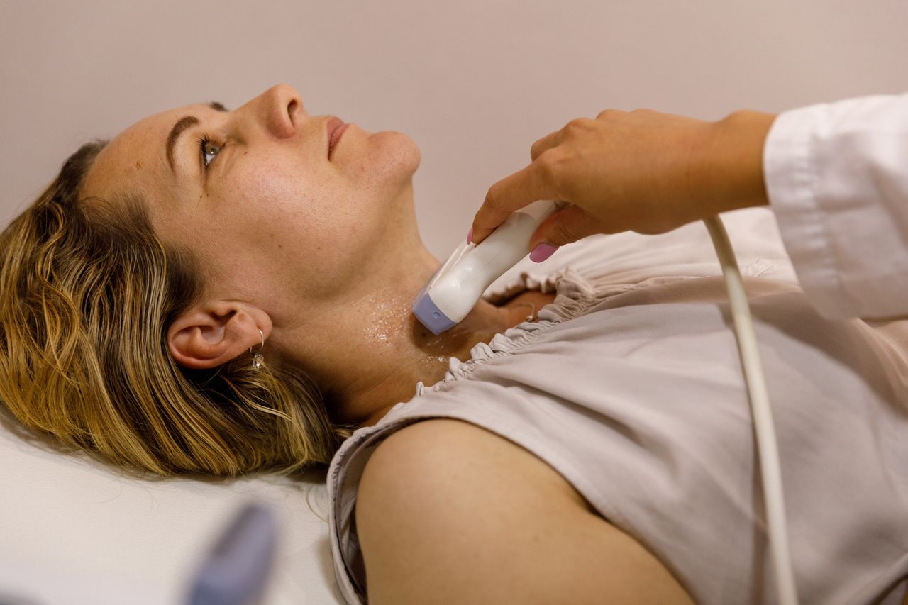 Woman getting throat ultrasound