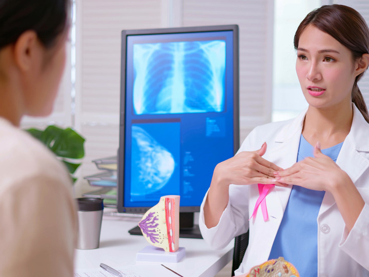 Woman Talking to Doctor about Mammogram
