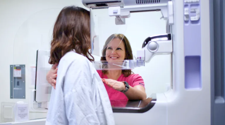 A woman prepares for her mammogram