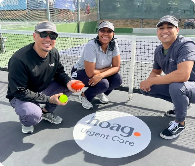 Medical professionals smiling on pickleball court