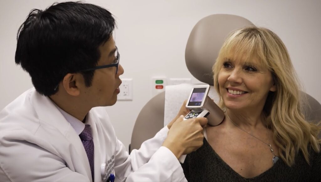 Dr. Wang Melanoma Expert with Patient