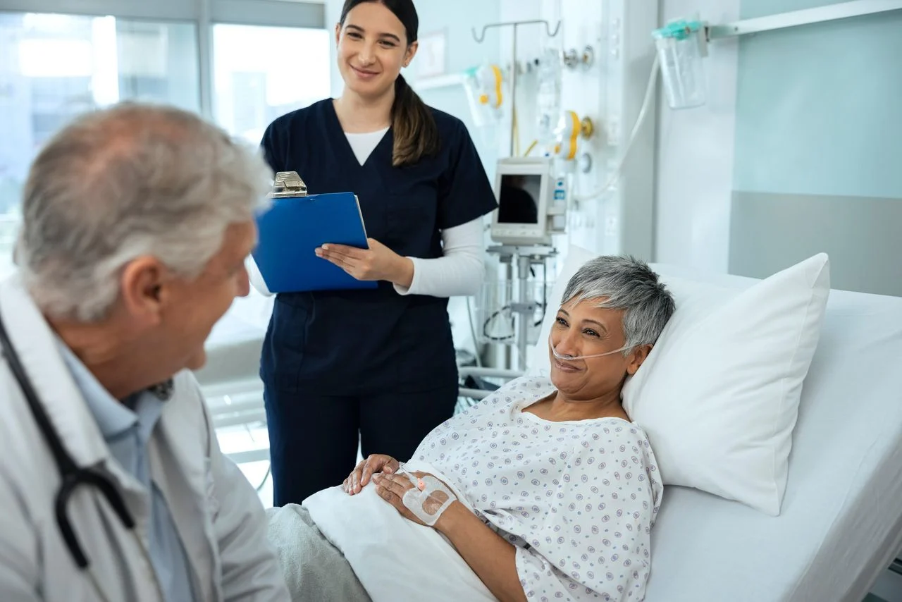 Doctor talking to patient & nurse