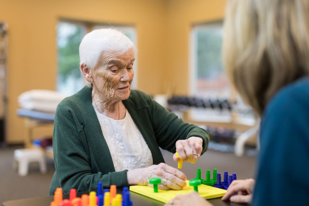 Old woman playing block game