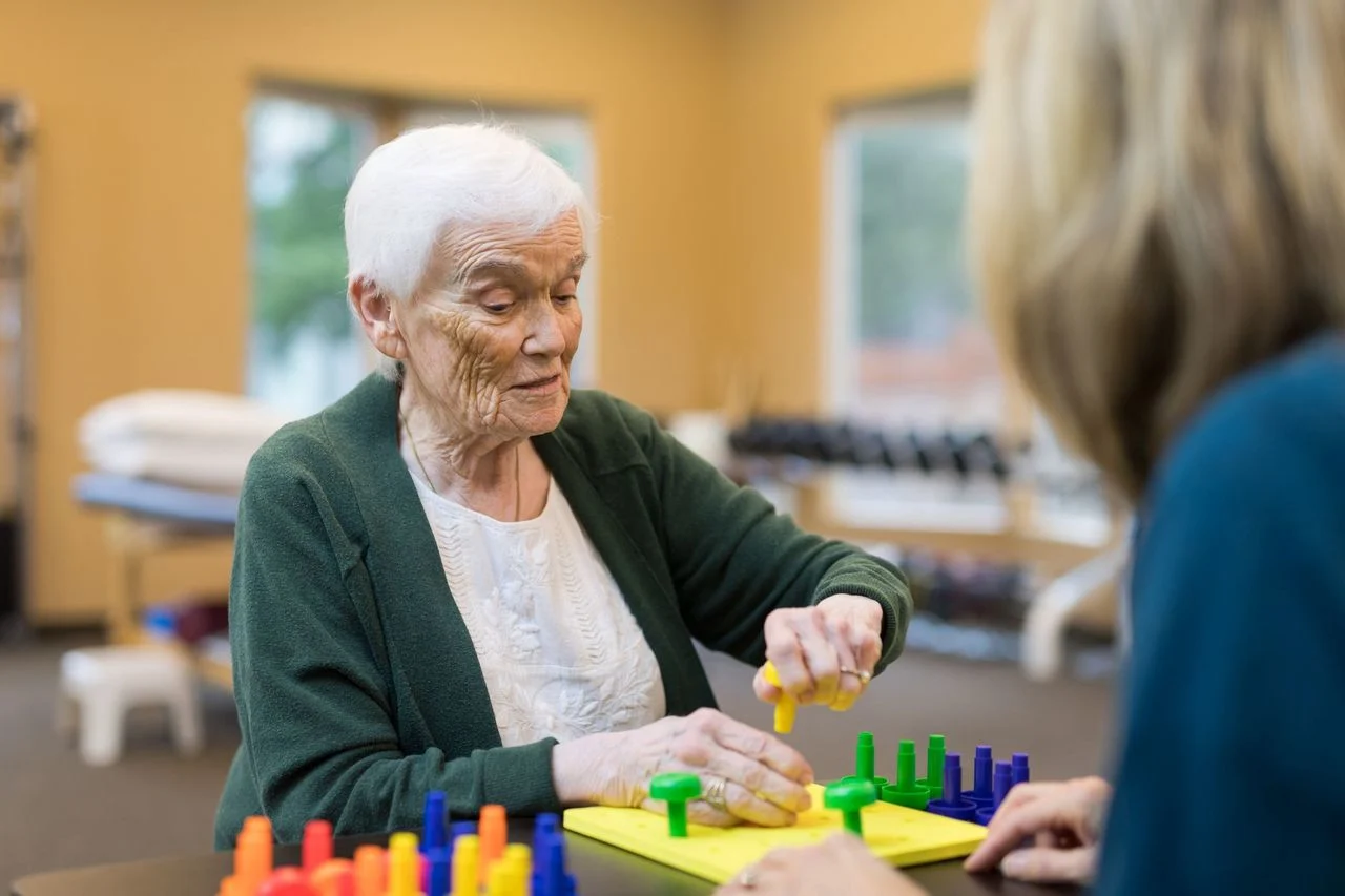 Old woman playing block game