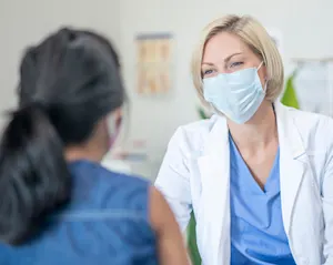 A patient meets with her primary care physician