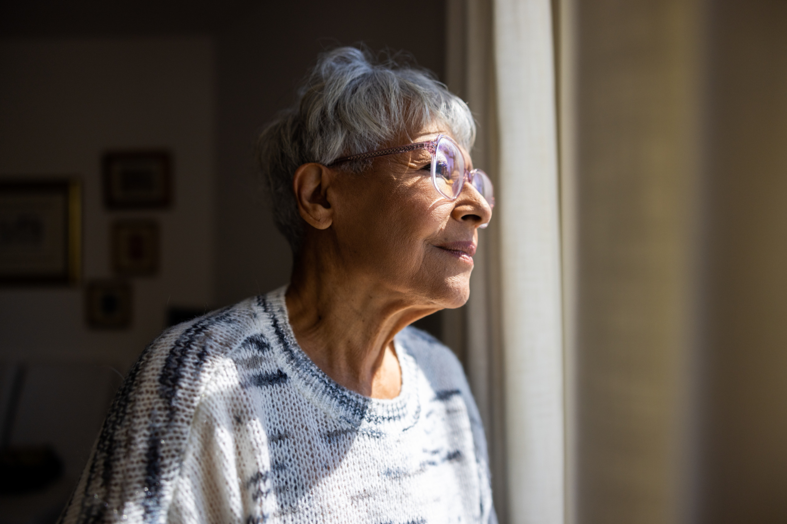 Woman looking out window