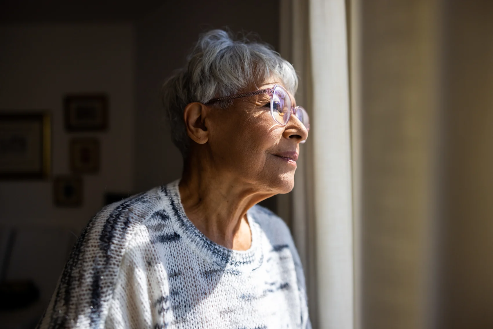 Woman looking out window