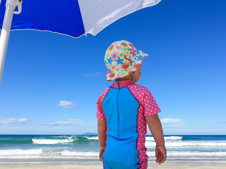 A child is enjoying a day at the beach