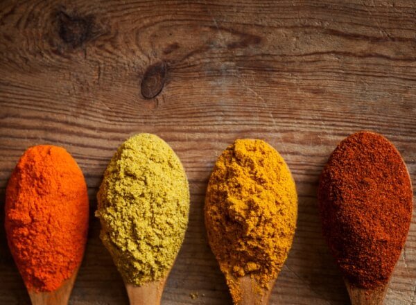 Four spoonfuls of different colored powders