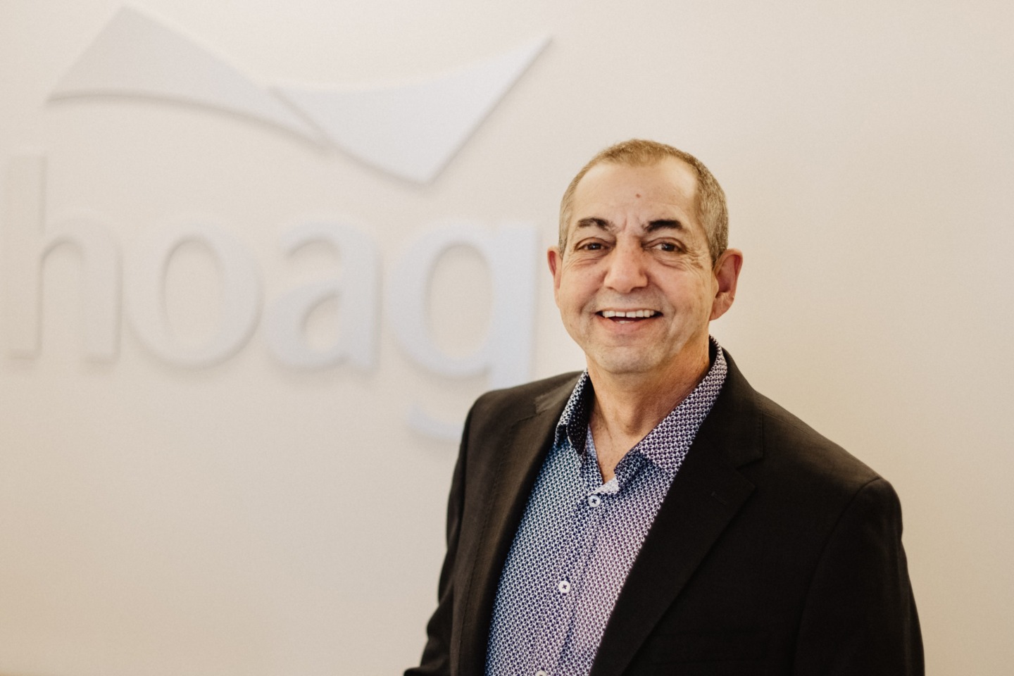 Ed Toplian, an oral cancer survivor, smiles at camera