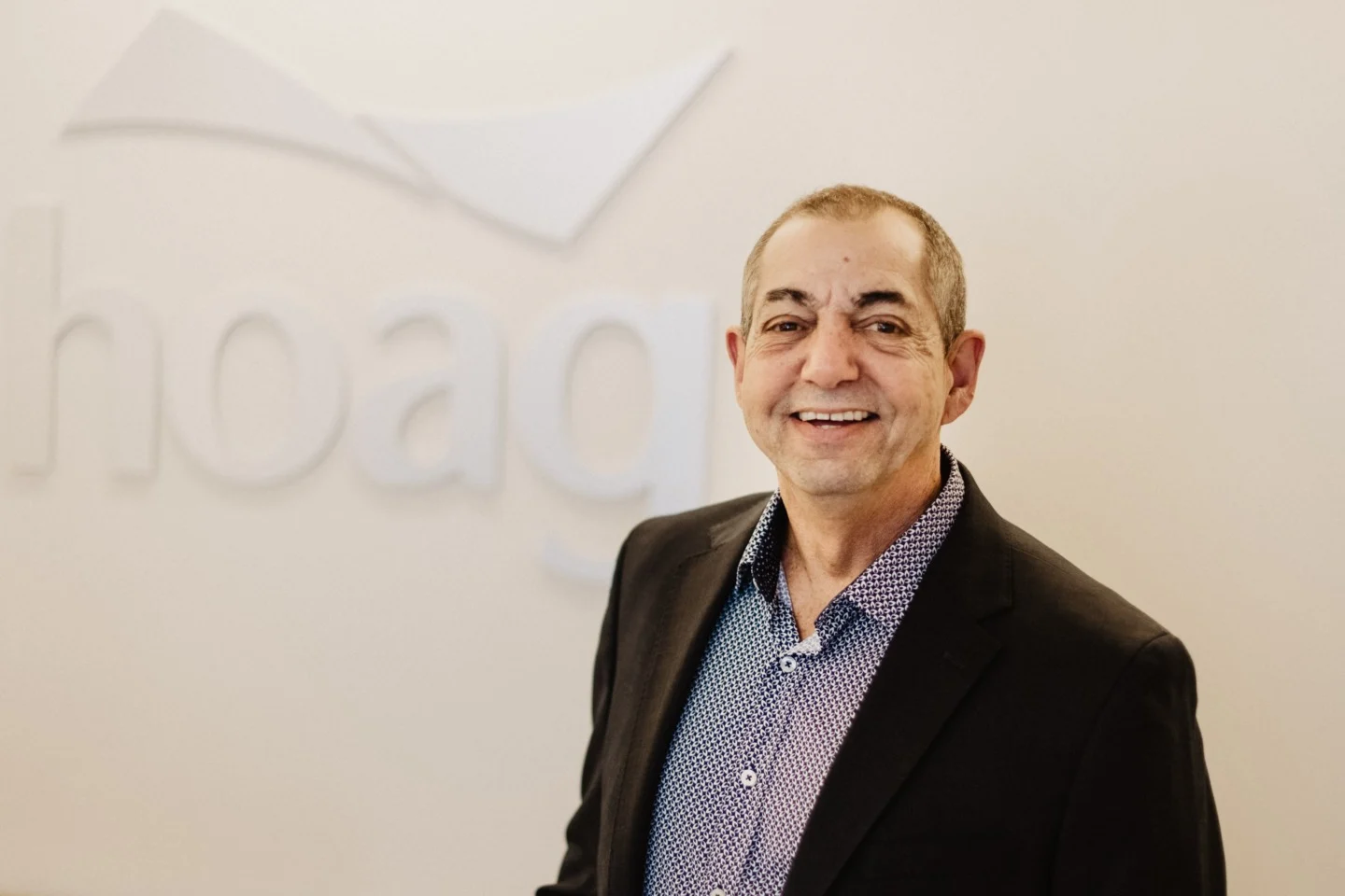 Ed Toplian, an oral cancer survivor, smiles at camera