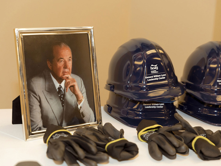 A framed picture of General William Lyon next to construction gear