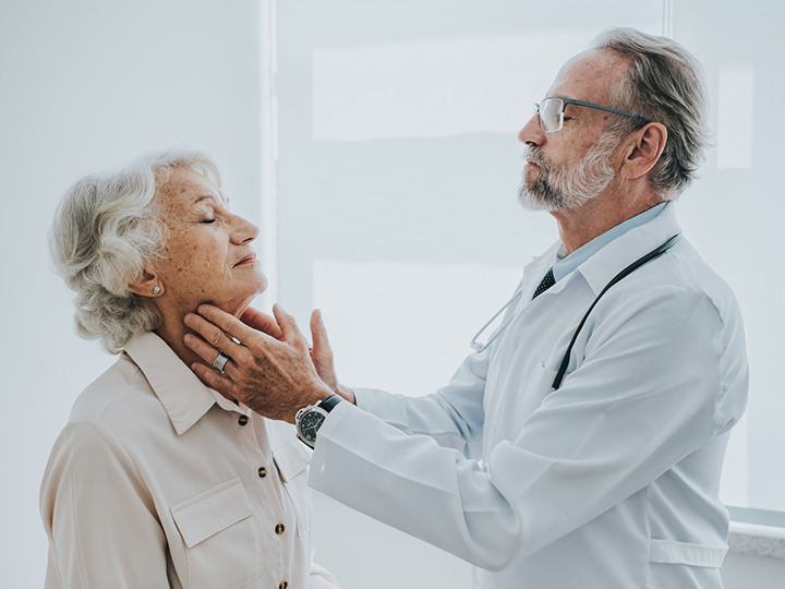 A doctor checks a patient's pulse