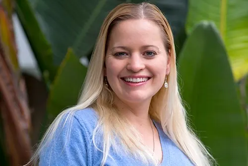 Melanie Comerio smiles at camera