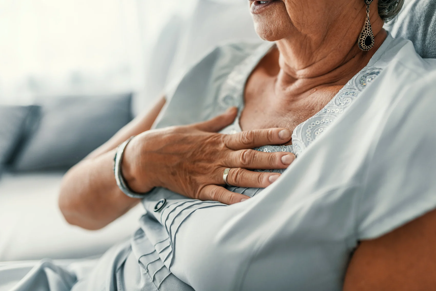 Elderly Woman's Hand on Heart