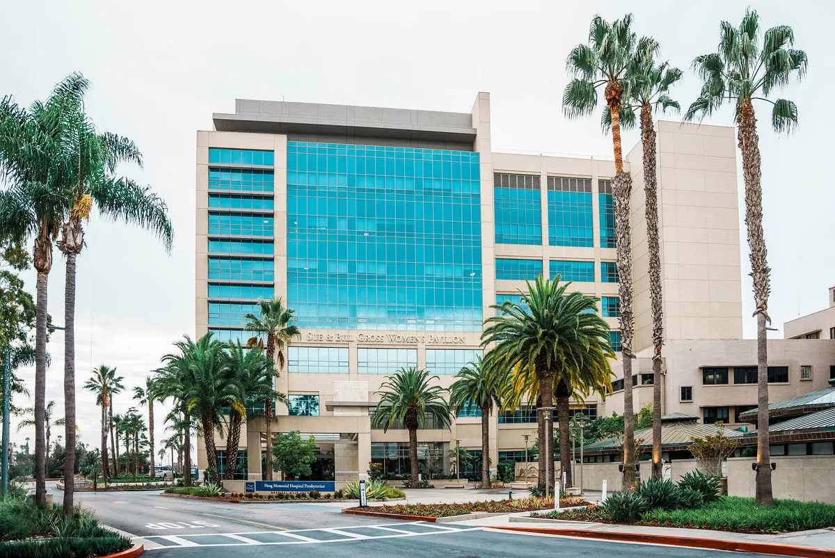 Sue & Bill Gross Women’s Pavilion exterior shot with palm trees in foreground