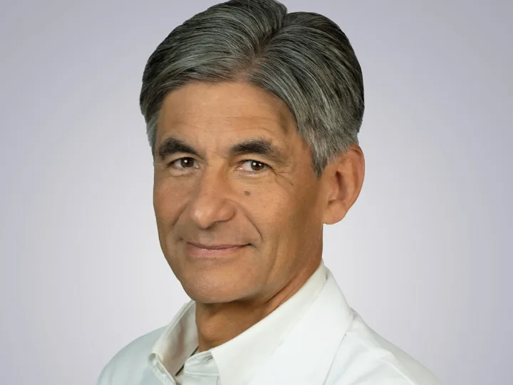 A headshot of Dr. Carlos Becerra