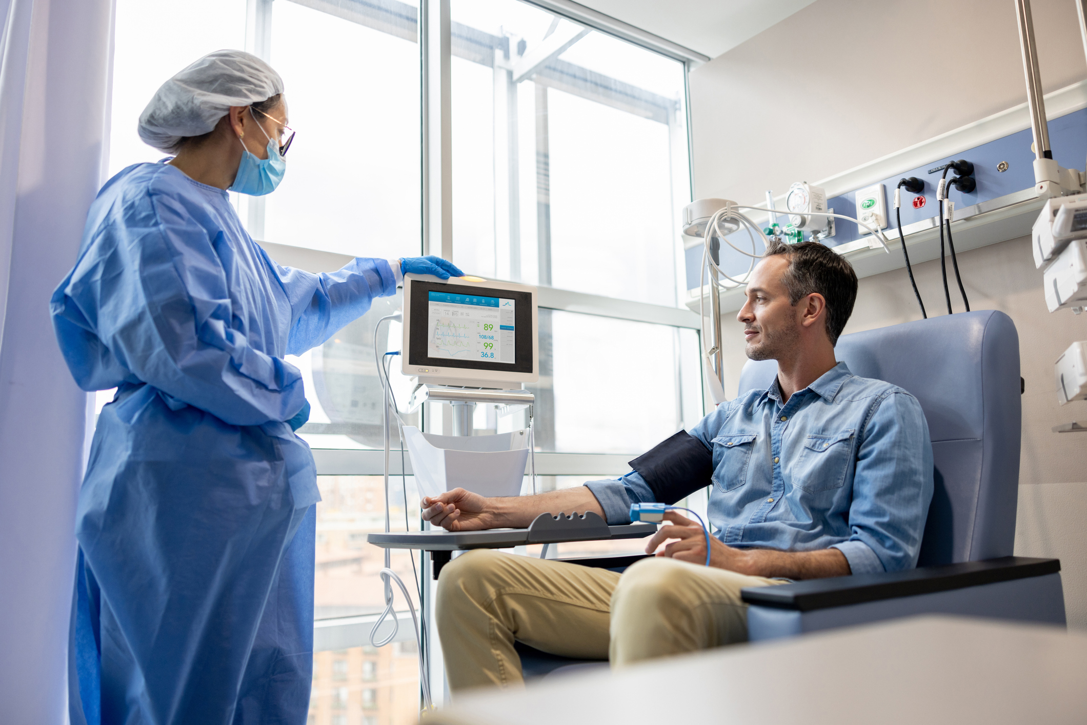 Man in chair taking blood pressure