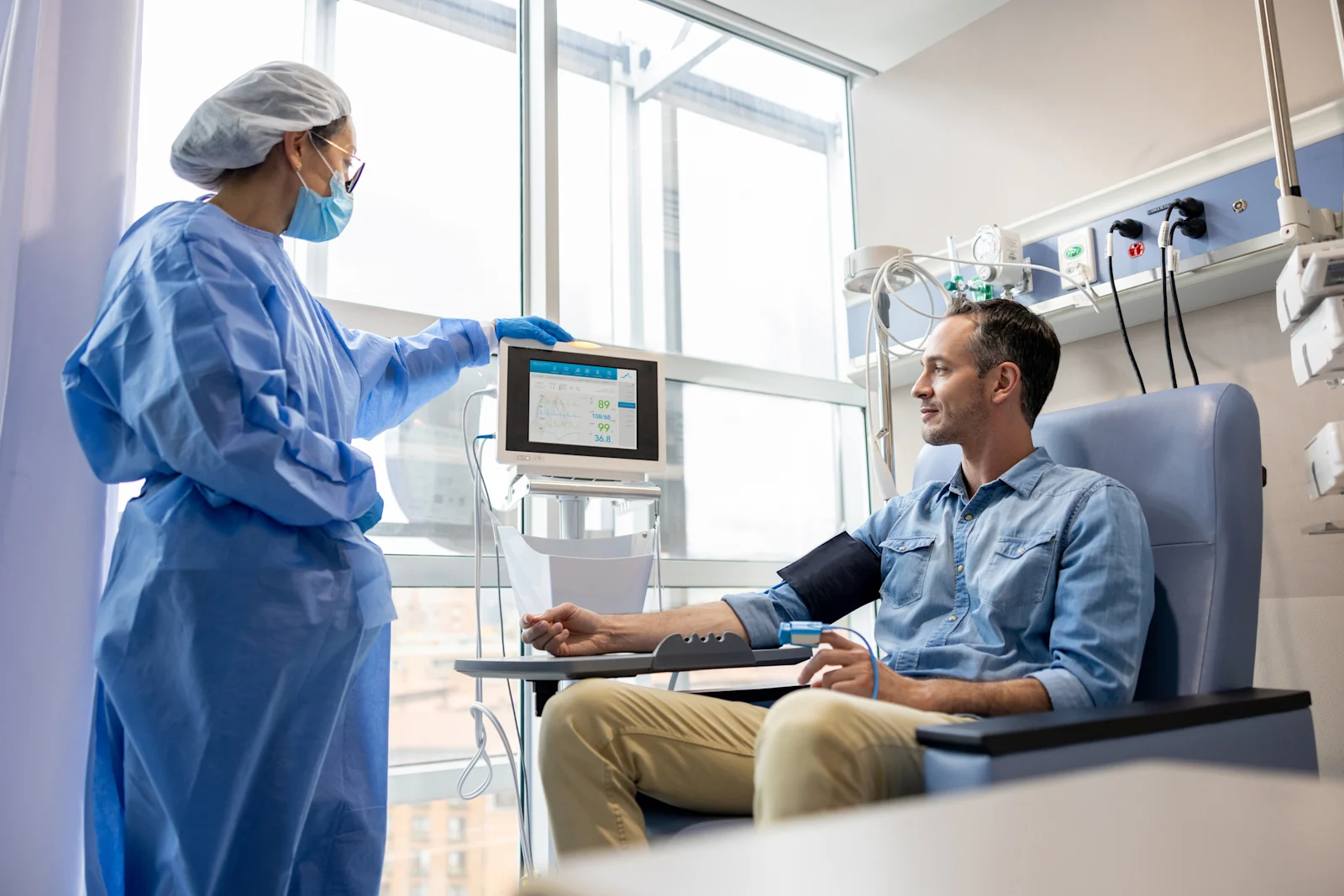 Man in chair taking blood pressure