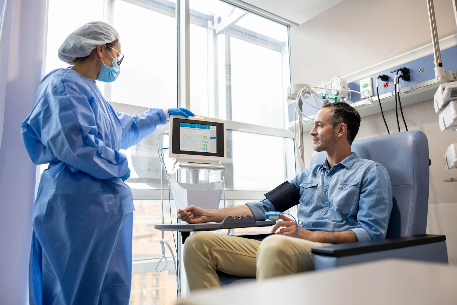 Man in chair taking blood pressure