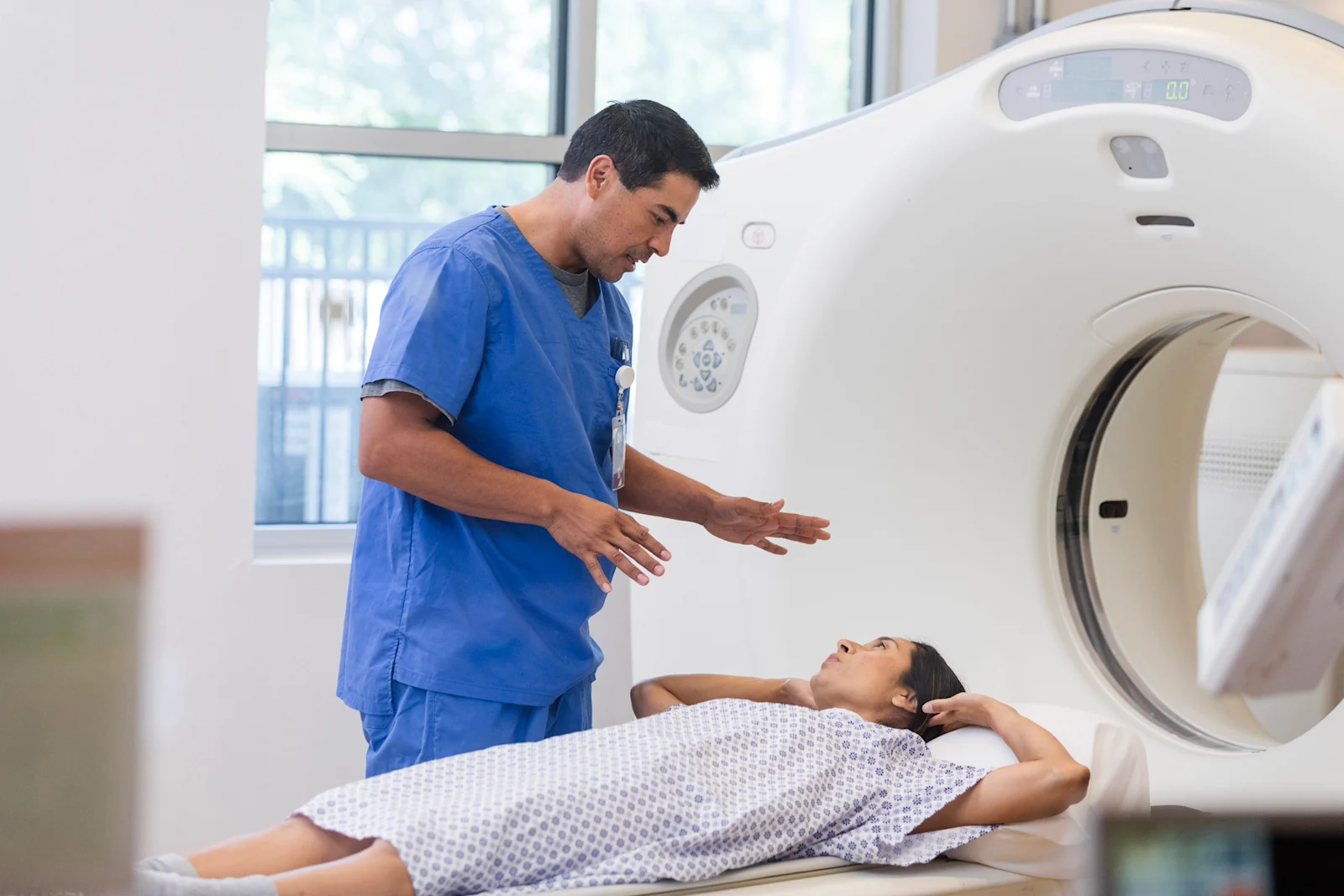 Female patient entering ViewRay MRIdian linear accelerator