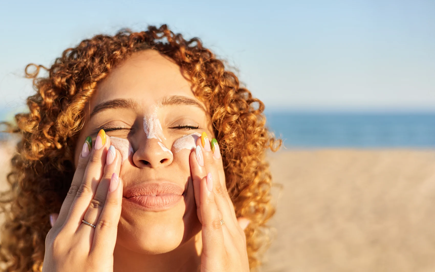 Woman Applying Sunscreen