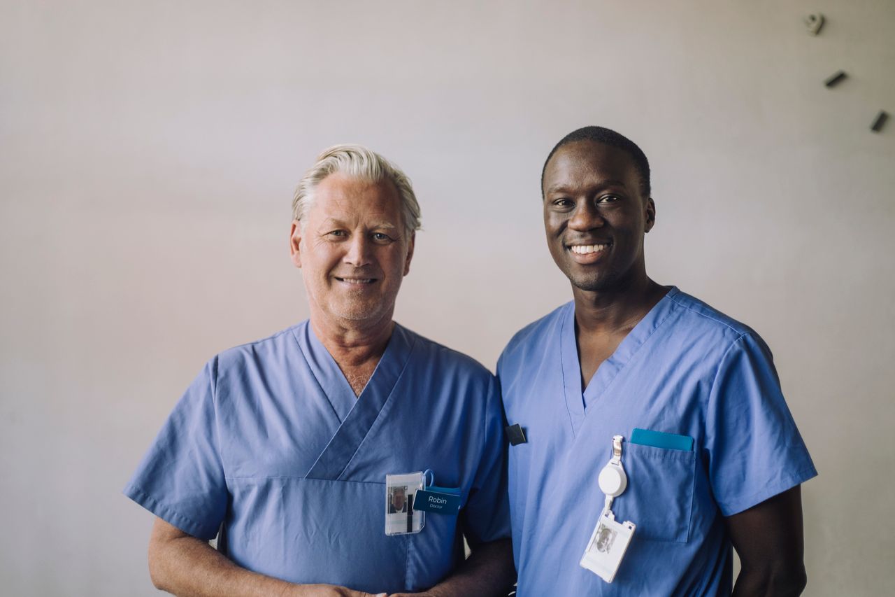 Nurses standing side by side and smiling