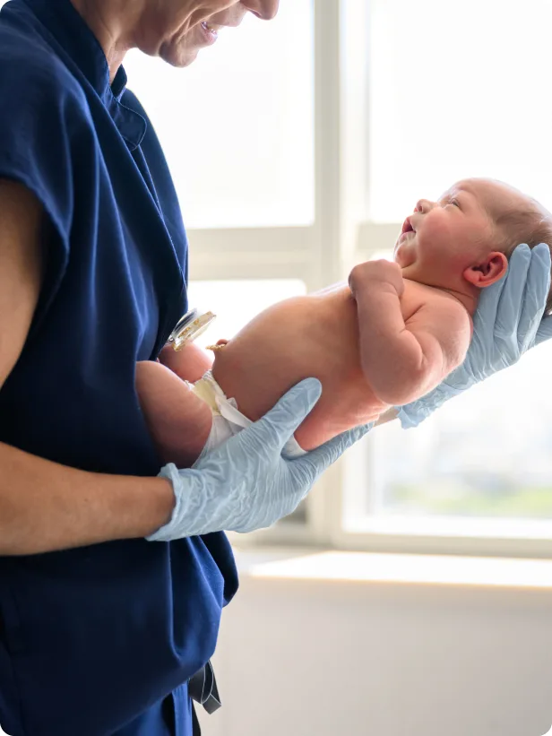 Maternity - physician and baby