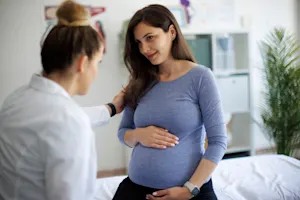 Pregnant woman with doctor