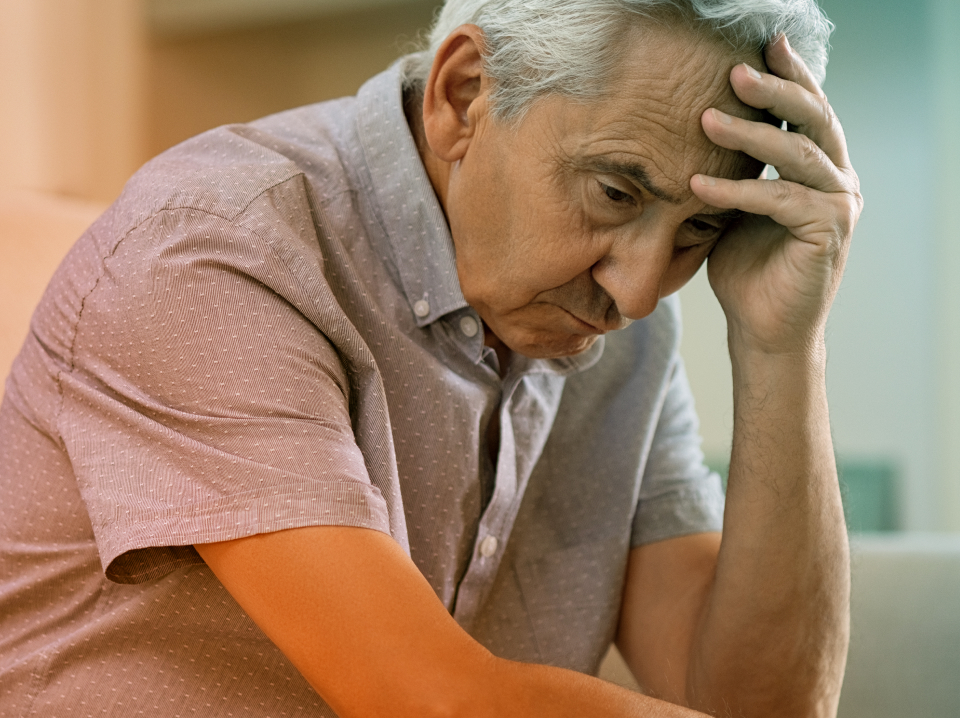 Elderly Man with Head in hand