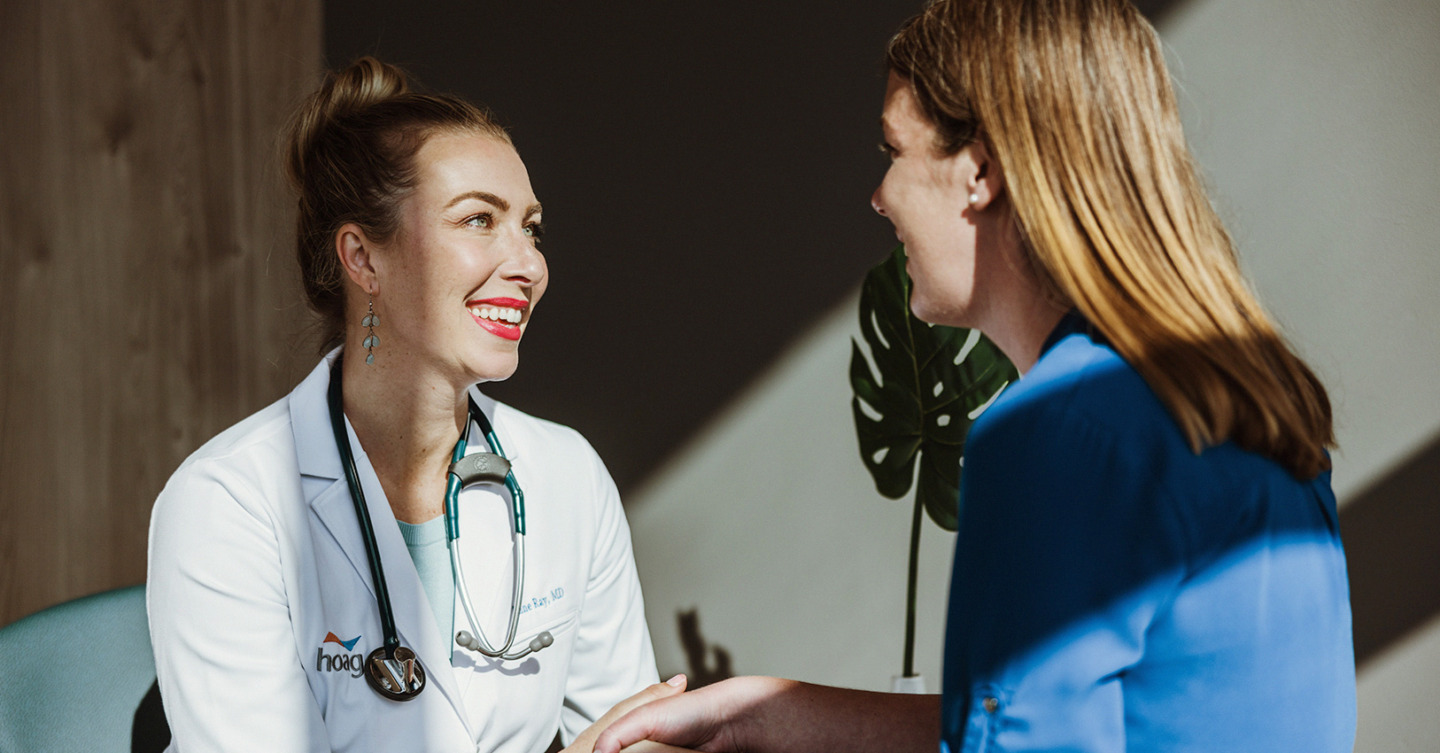 Doctor Smiling, talking to patient