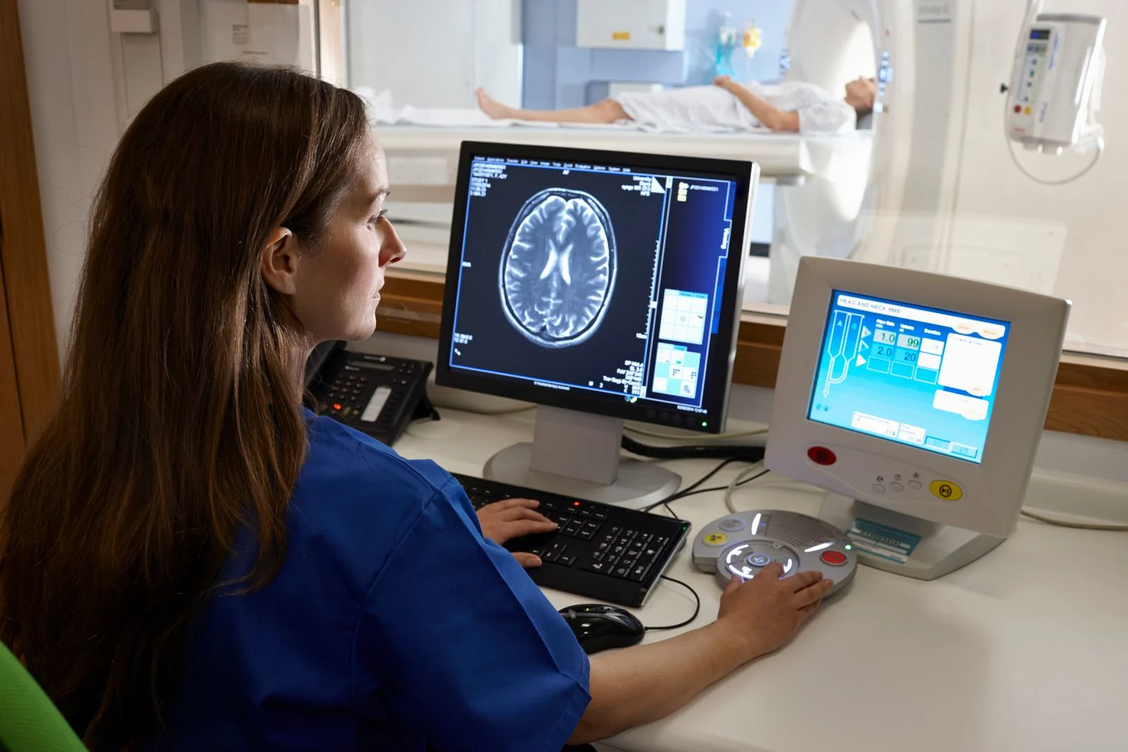 A doctor looks at a brain scan