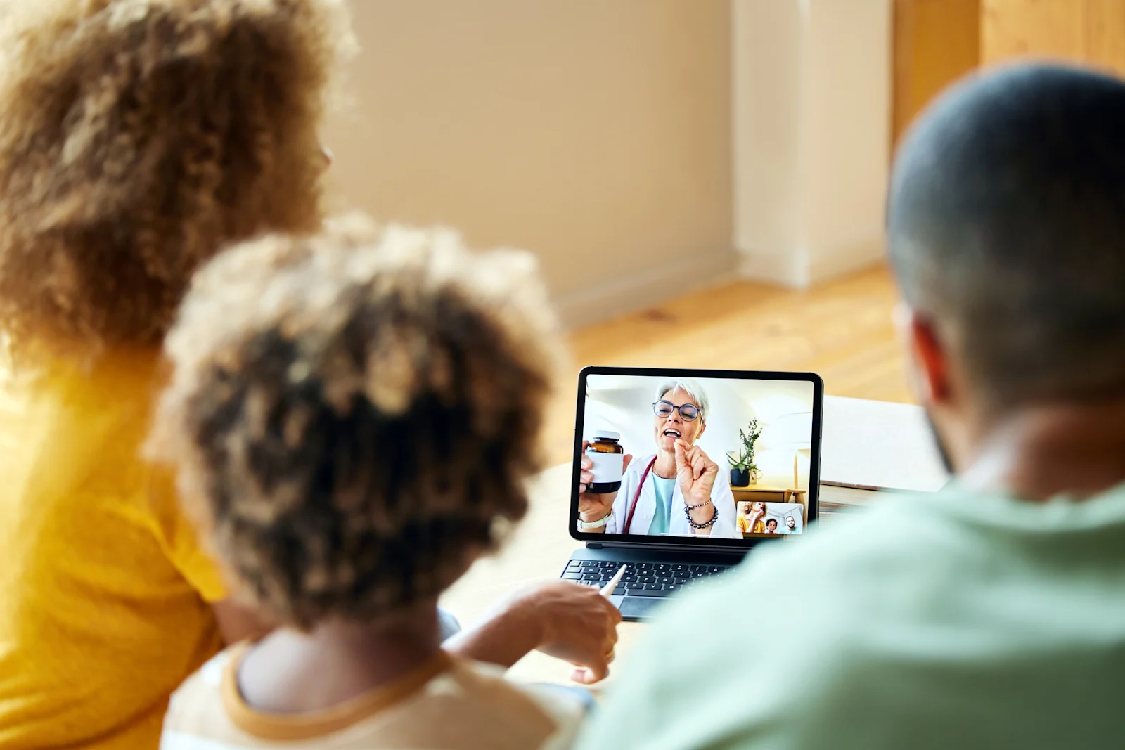 Family seeing doctor for telehealth visit