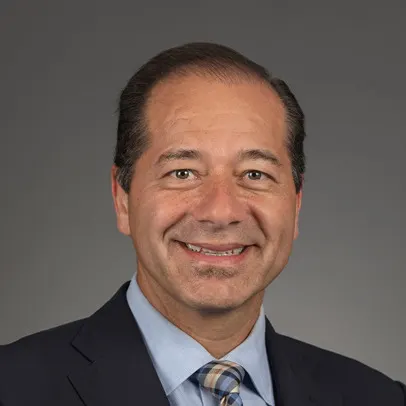 A headshot of Dr. Gustavo Alva