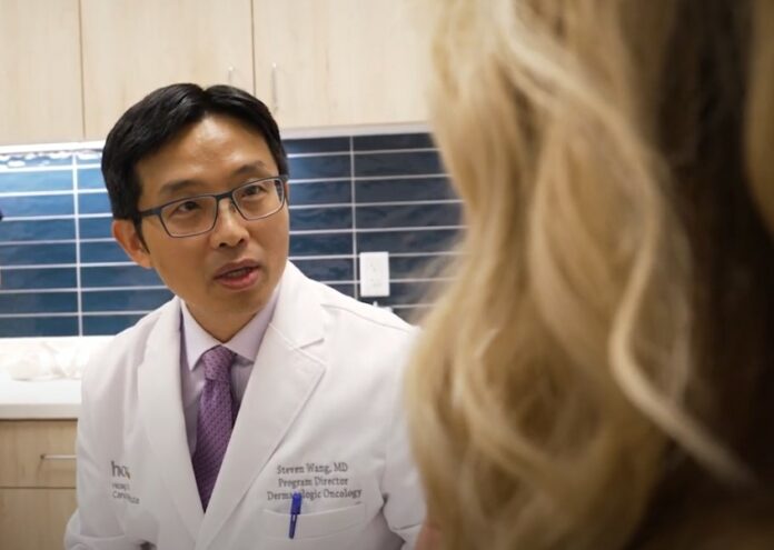 Steven Q Wang MD Speaking with a Patient