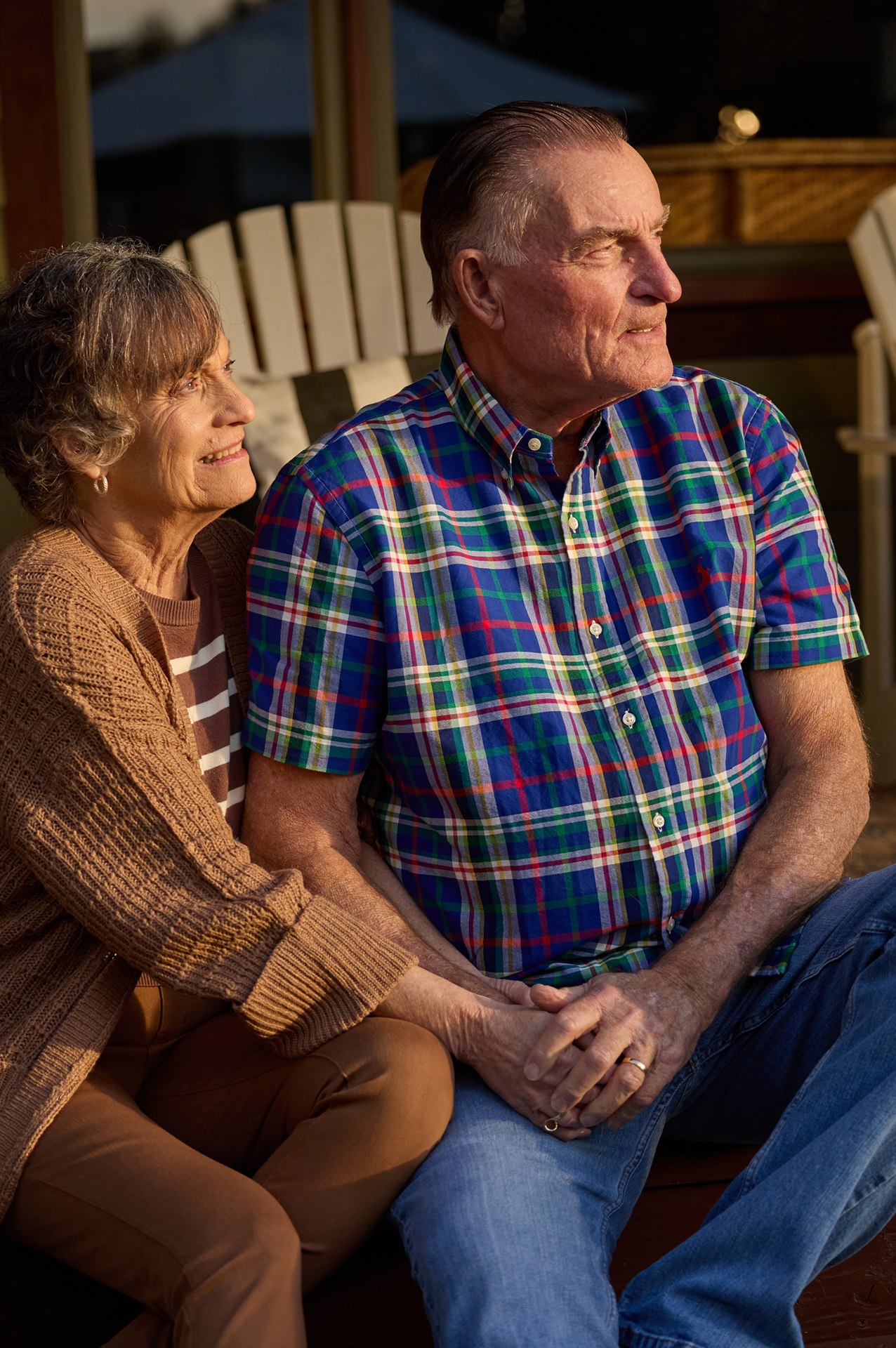 Rick and his wife sitting on porch