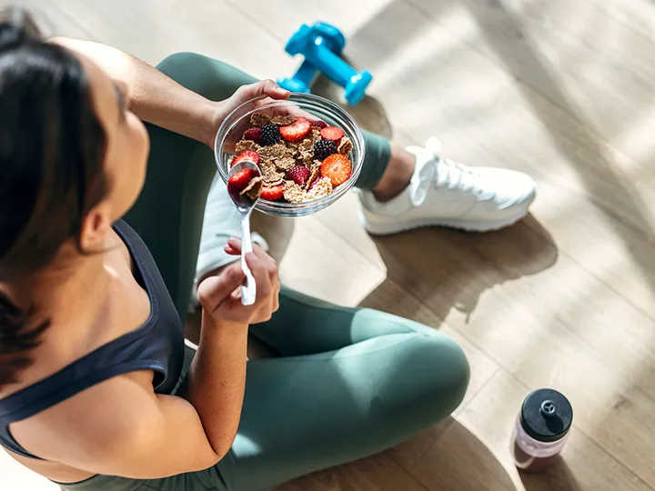 Woman eating smoothie bowl