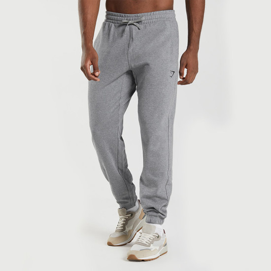 Cozy and Casual: Charcoal Beanie, White T-Shirt, Grey Sweatpants, and  Athletic Shoes