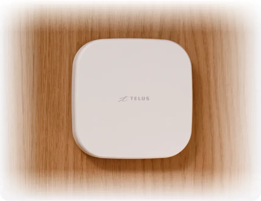 A SmartHome+ Hub mounted on a wooden wall.