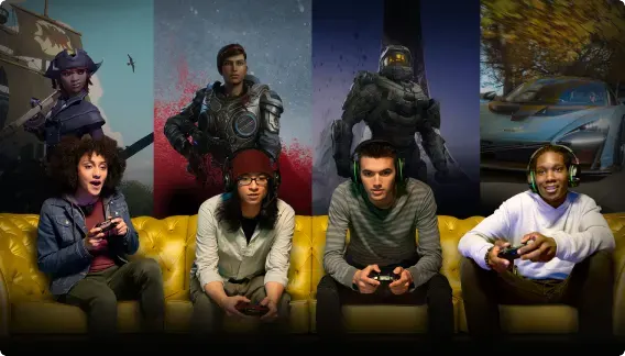 Four friends sitting on a couch, intently playing a game with Xbox Game Pass Ultimate.