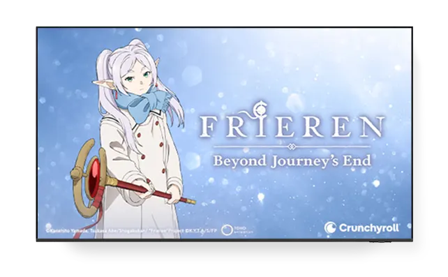 A TV displaying the poster for ‘Frieren - Beyond Journey’s End’ with the Crunchyroll logo on the bottom right.