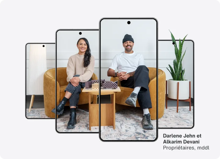 Four phones lined up in a row with an image of two business owners sitting spanning all four phones.