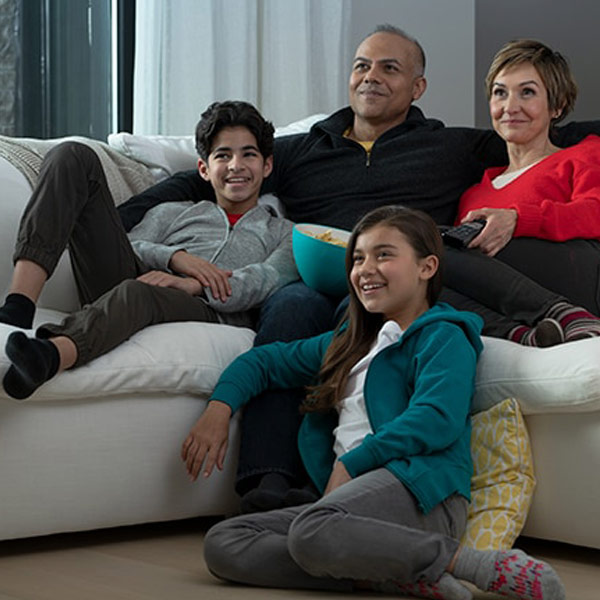 Family enjoying recorded game on Cloud PVR