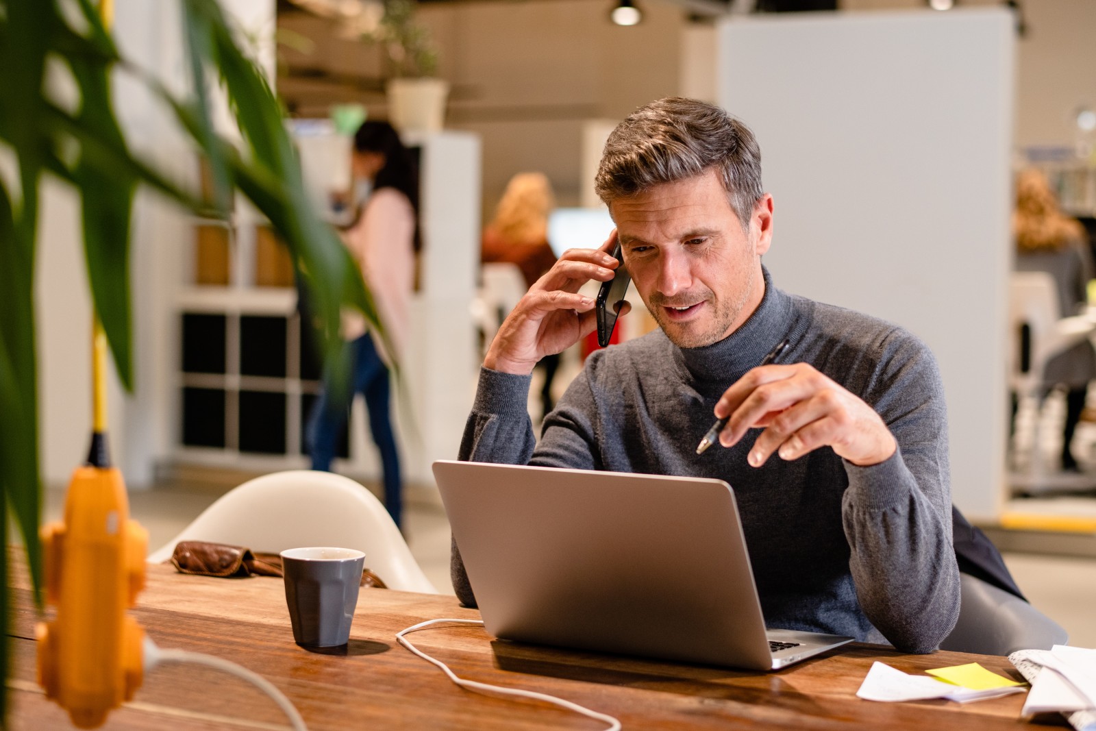 Man working behind laptop