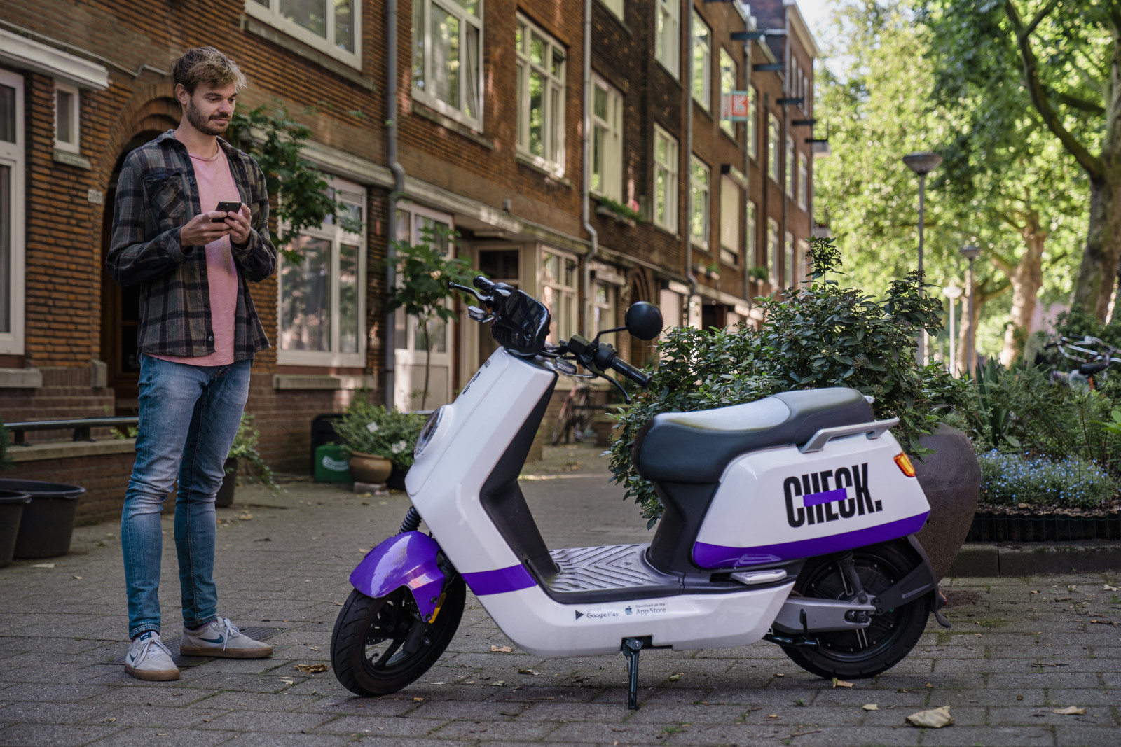 Man and Check scooter