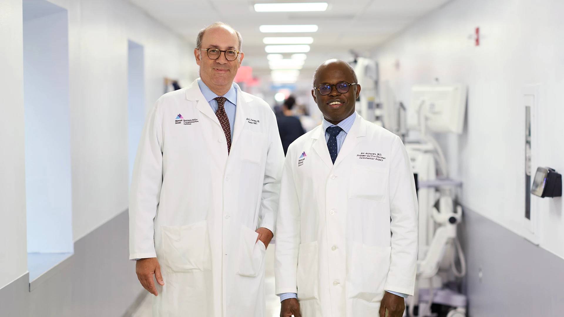 Sander Florman, MD, left, Charles Miller, MD, Professor of Surgery and Director of the Recanati/Miller Transplantation Institute at Mount Sinai, and Anelechi Anyanwu, MD, Vice Chair of Cardiovascular Surgery for the Mount Sinai Health System, take a quick break in the midst of their hectic schedules in a corridor just outside the OR where they performed the triple transplants. Click here to watch the news story on CBS News. 