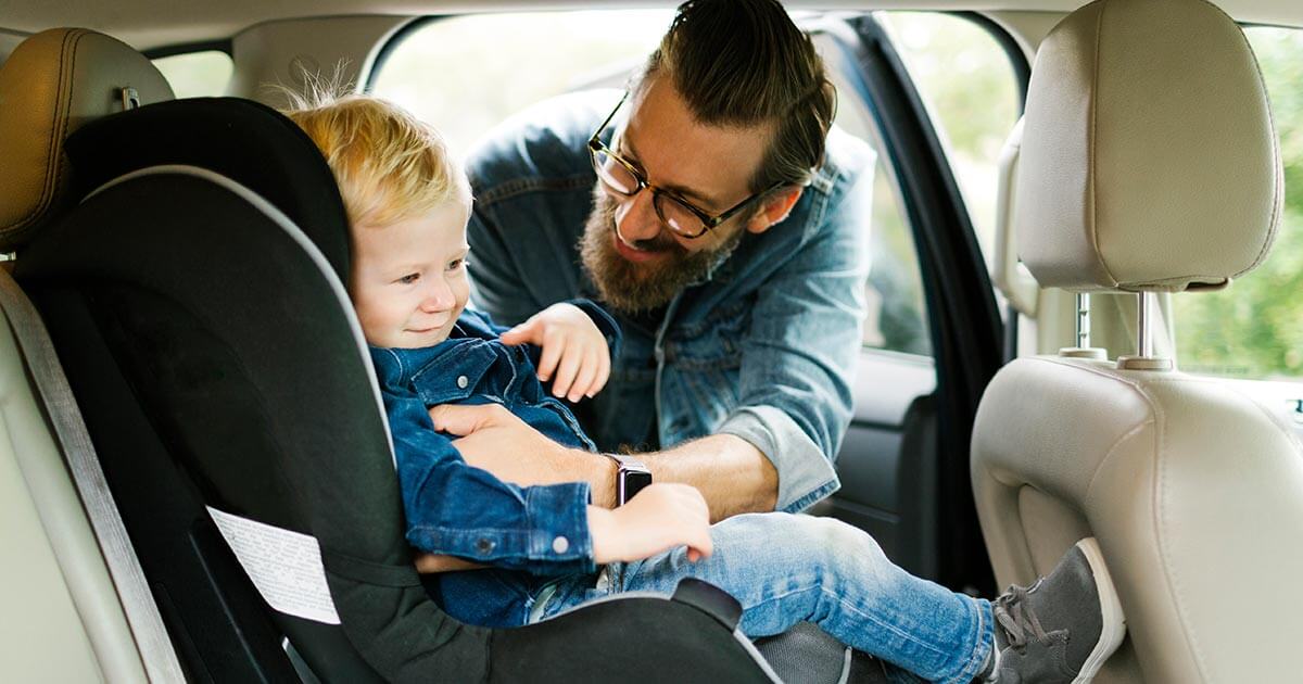 law on child sitting in front of car